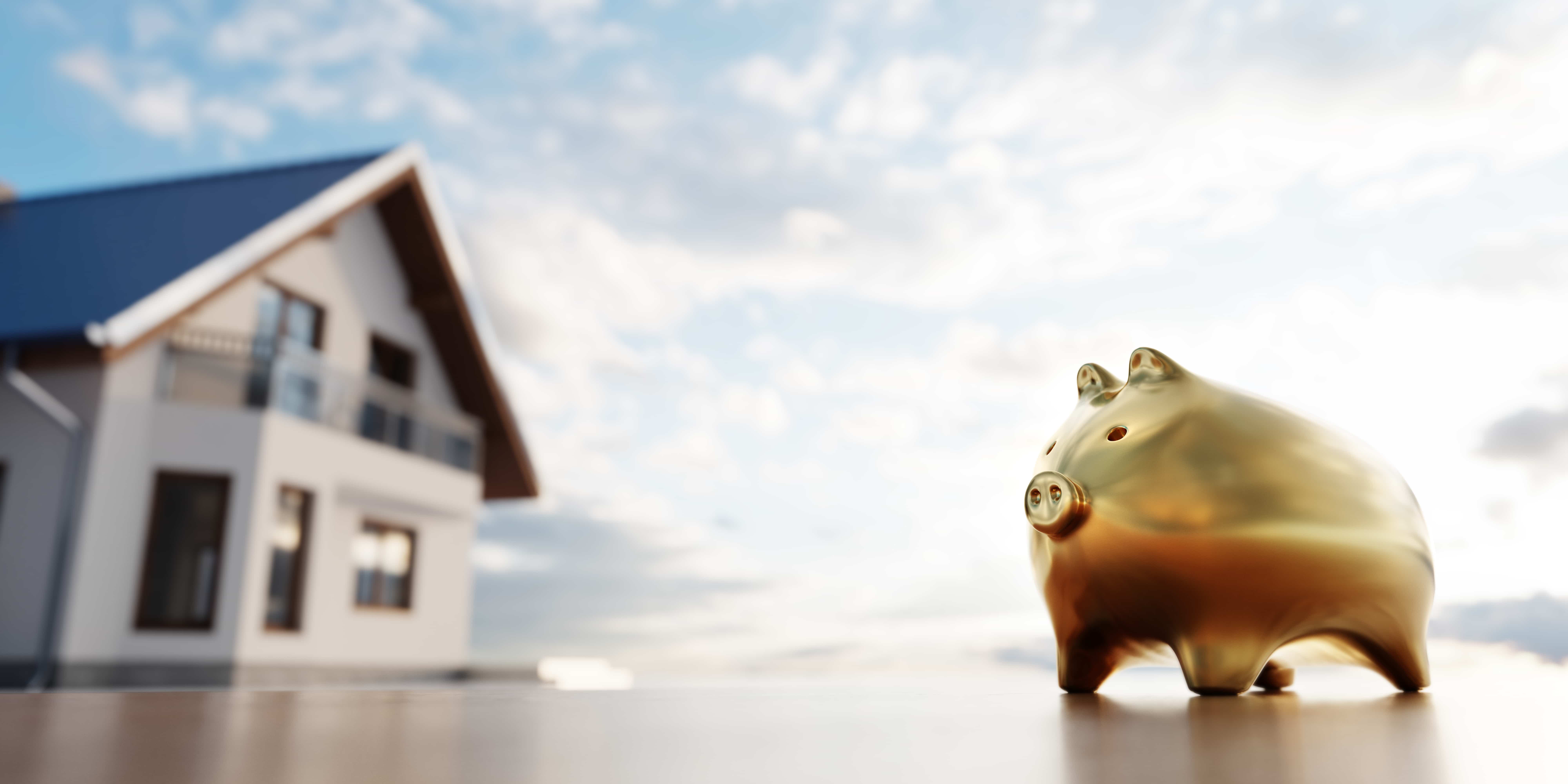 A house and a savings piggy in a new neighborhood 