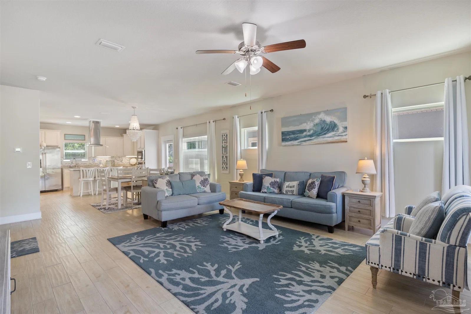 Furnished coastal living room at 13987 Hanging Branch Way