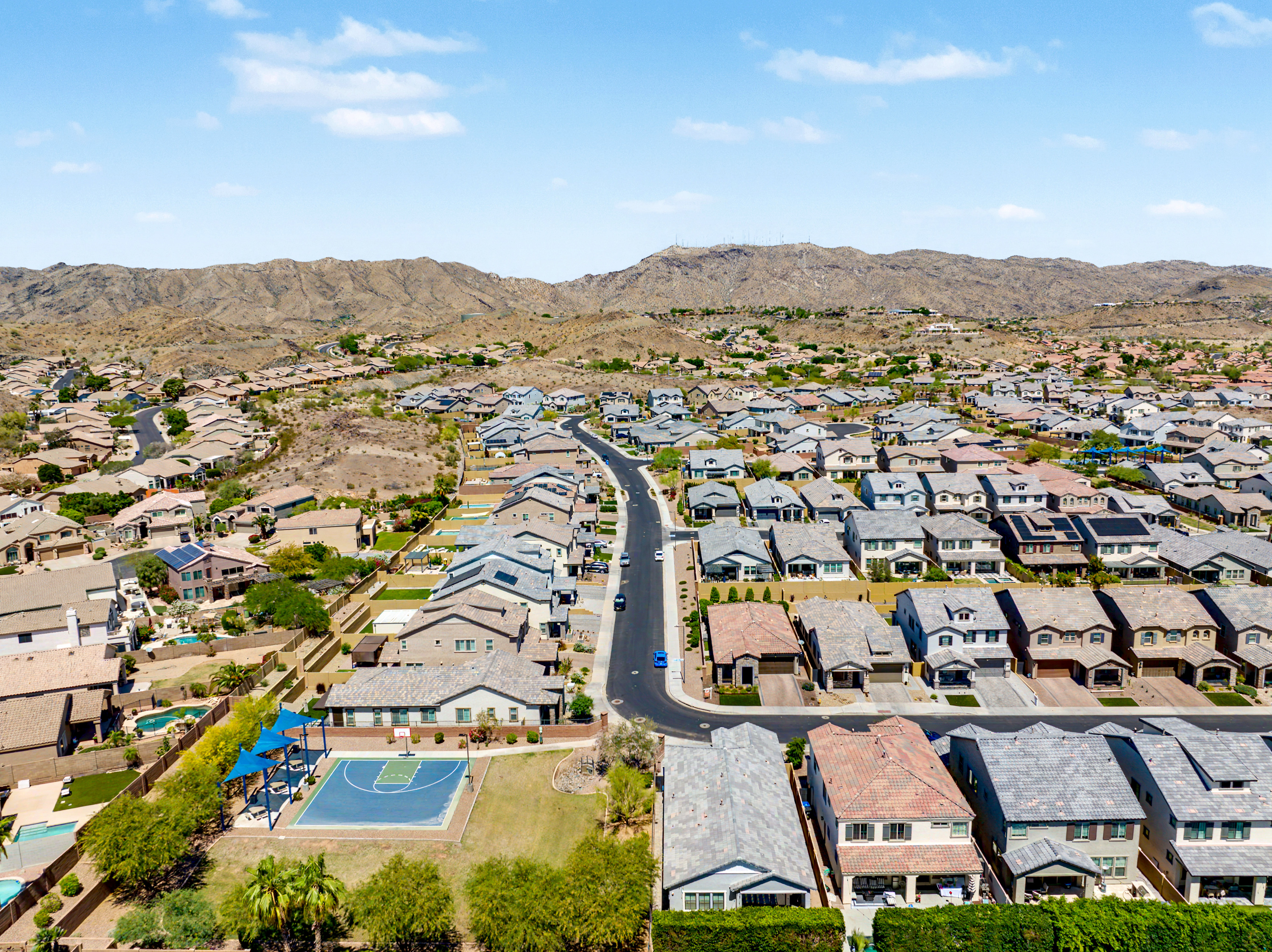 Aerial view of an Ahwatukee Foothills neighborhood with South Mountain Preserve in the background