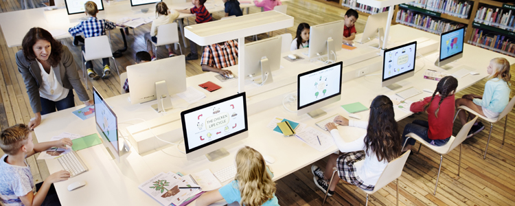 Students Learning in School Library on Computers