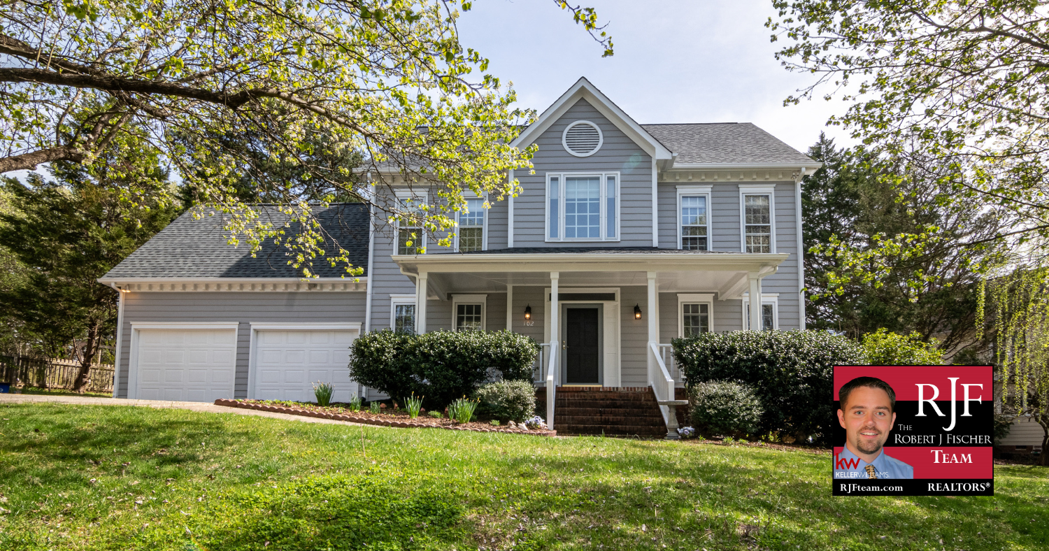 A picture of a house for sale with the Robert J Fischer Team logo in the bottom right corner.