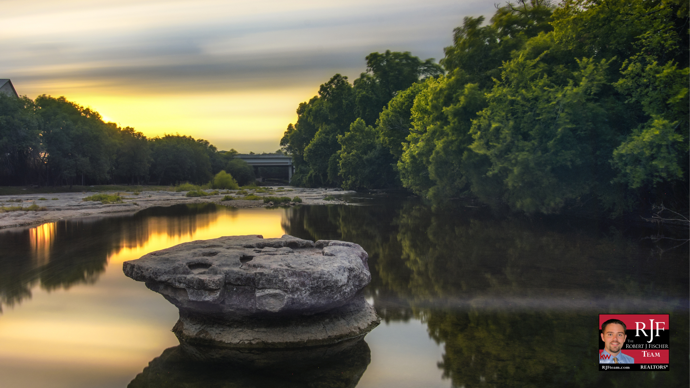 A picture of the Round Rock, TX round rock at sunset with the Robert J Fischer Team logo in the bottom right corner.