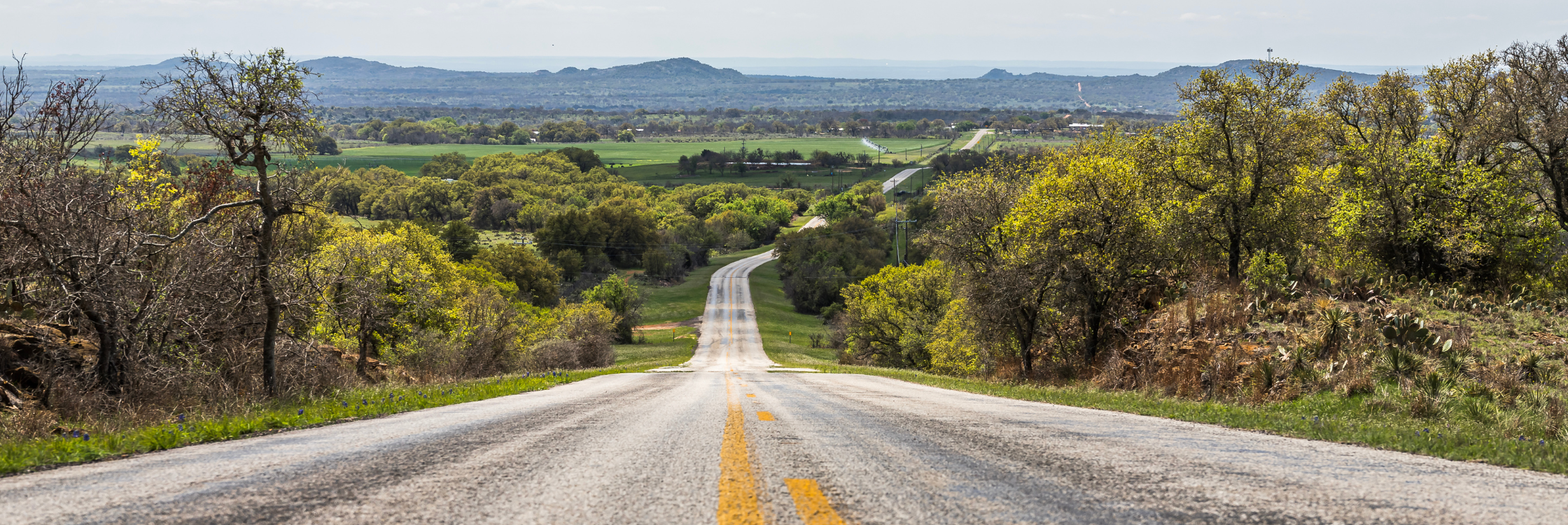 Photo of a winding road through the Texas Hill Country