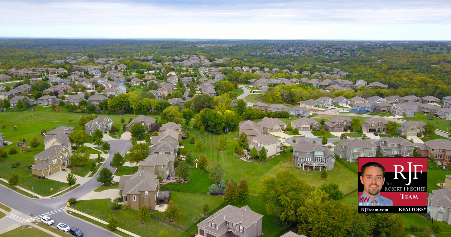 Aerial shot of a neighborhood with the Robert J Fischer Team logo in the bottom right corner