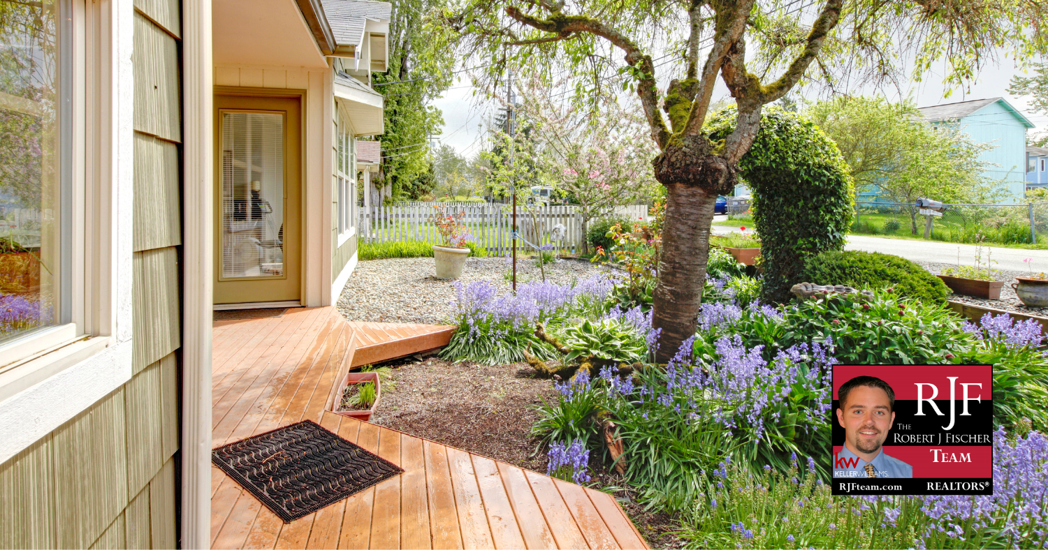 Fresh and clean curb appeal to maximize home worth with the Robert J Fischer Team logo in the bottom right corner.