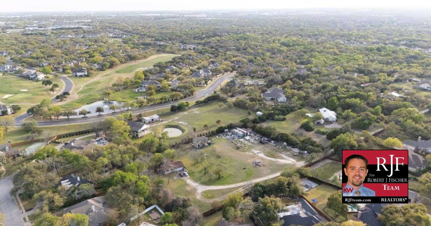 An aerial image of Round Rock with the Robert J Fischer Team logo in the bottom right corner