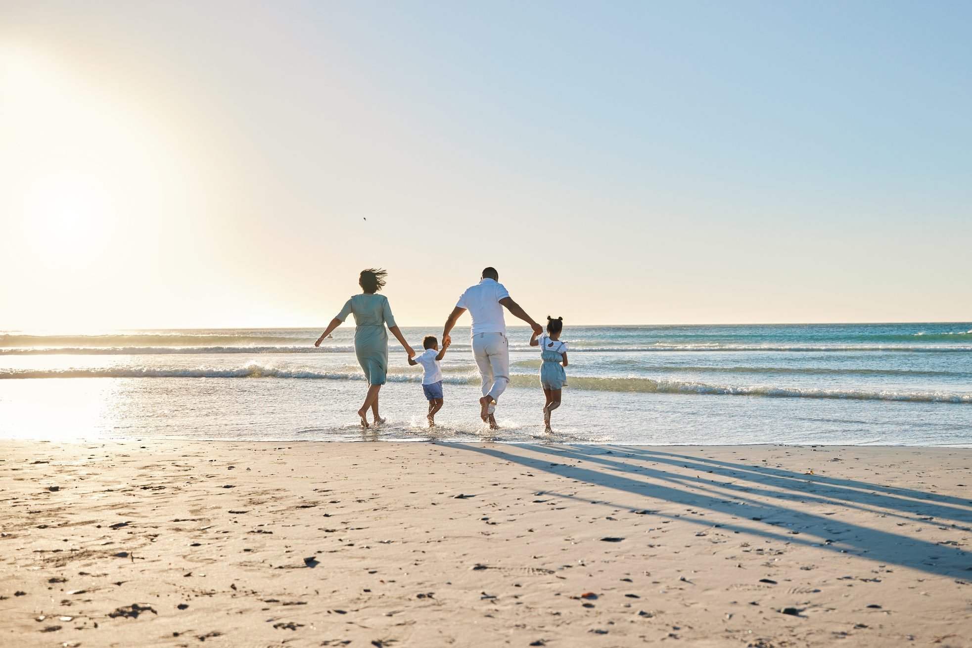 A family walking on the beach at sunset in Puerto Peñasco (Rocky Point), Mexico