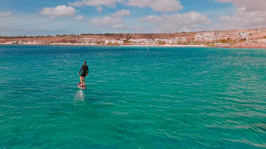 Richard Gadoury e-foiling in front of Puerta Cortés marina and beach, La Paz, Baja California Sur, Mexico