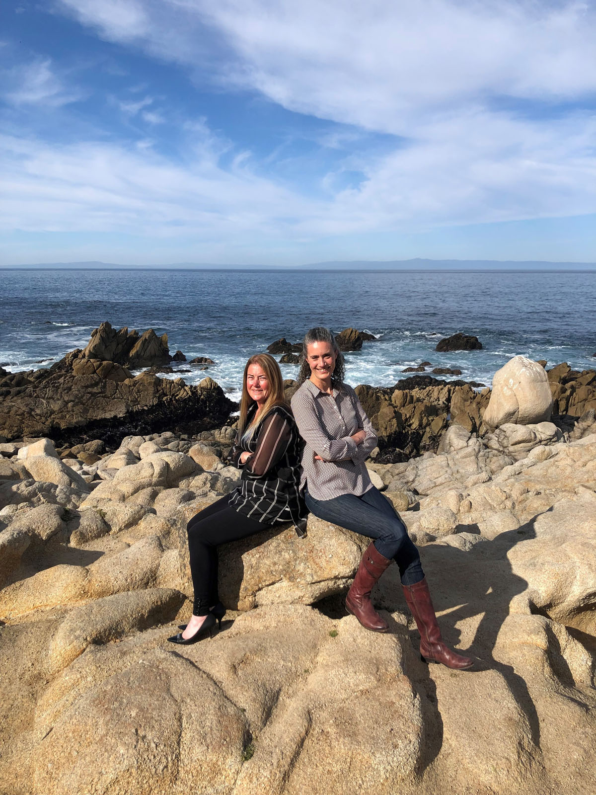 Teresa Bruno on the left and Nichole Fisher on the right, Monterey Peninsula Home Team, on the rocky Monterey Peninsula coastline