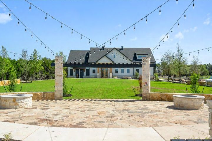 Backyard of a new home with string lights