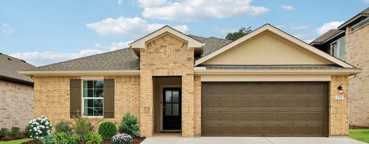 Front of a newly built brick and stone home