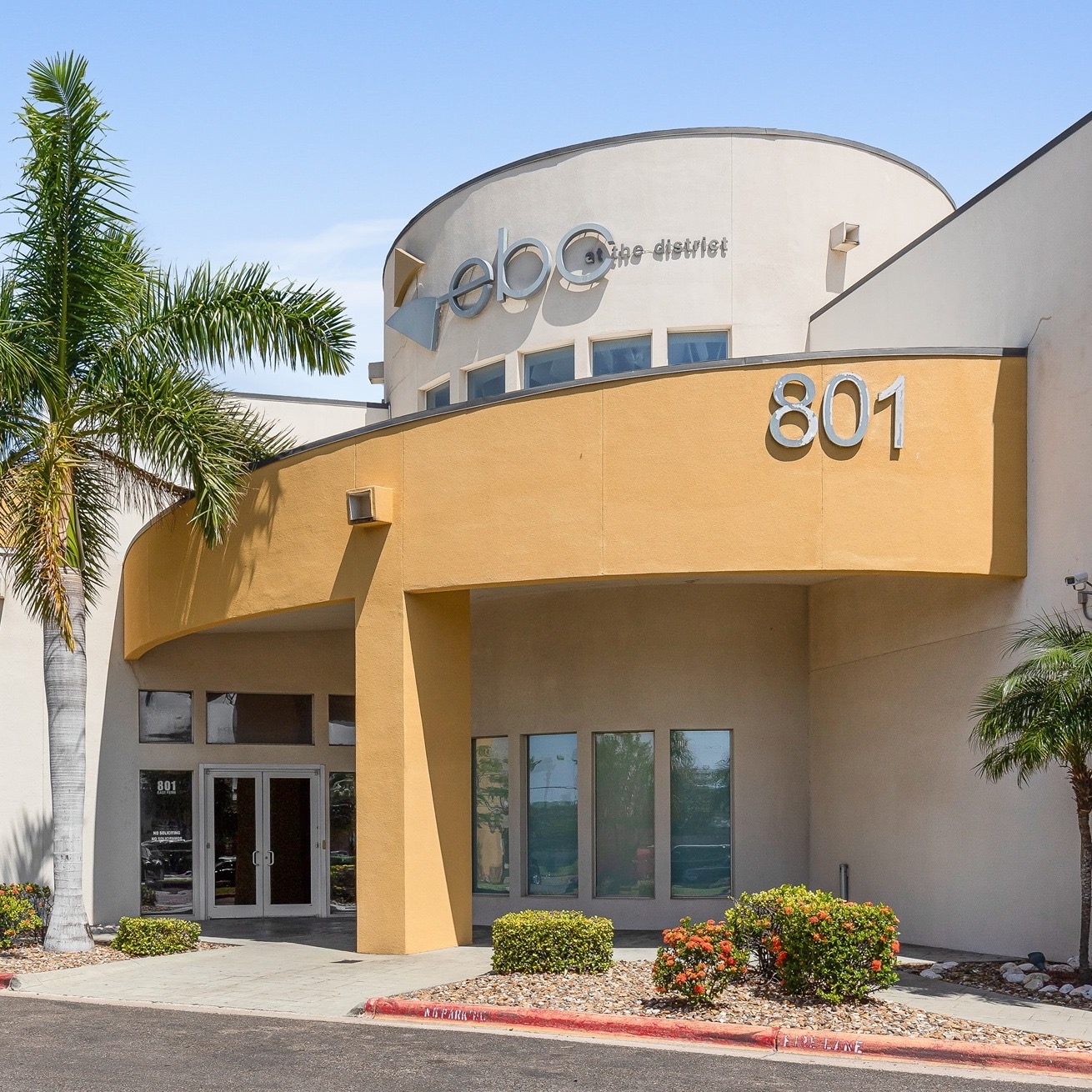 Entrance of The District commercial building at 801 E Fern Avenue in McAllen, Texas