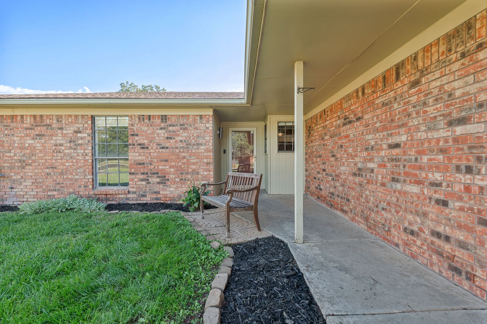 Brick front porch and entry of the home at 3309 Burrus Place in Puckett West, Amarillo TX