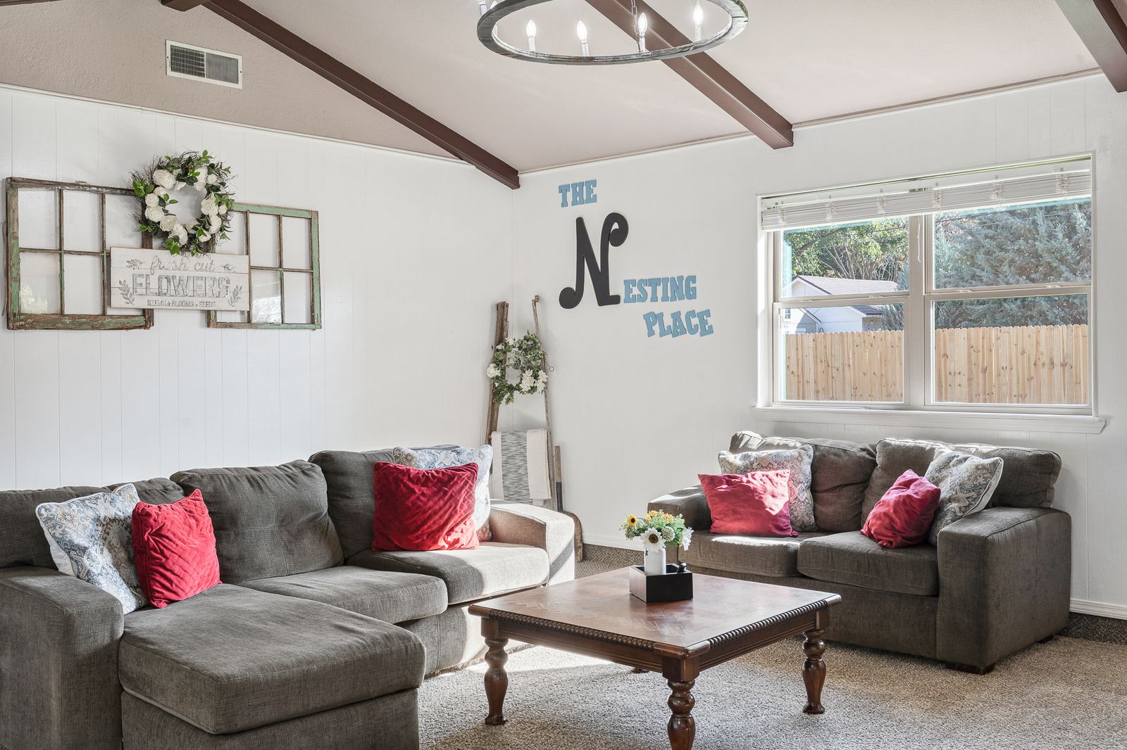 Living room with vaulted ceiling and exposed wood beams at 3309 Burrus Place Amarillo TX
