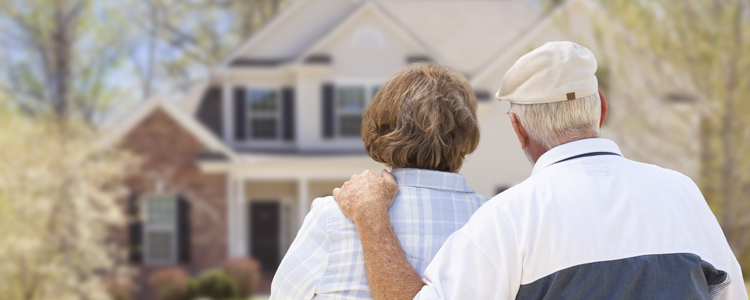 Retired Couple Looking At House