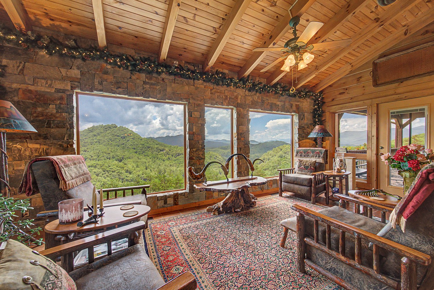 Sunroom with wide windows facing the mountains