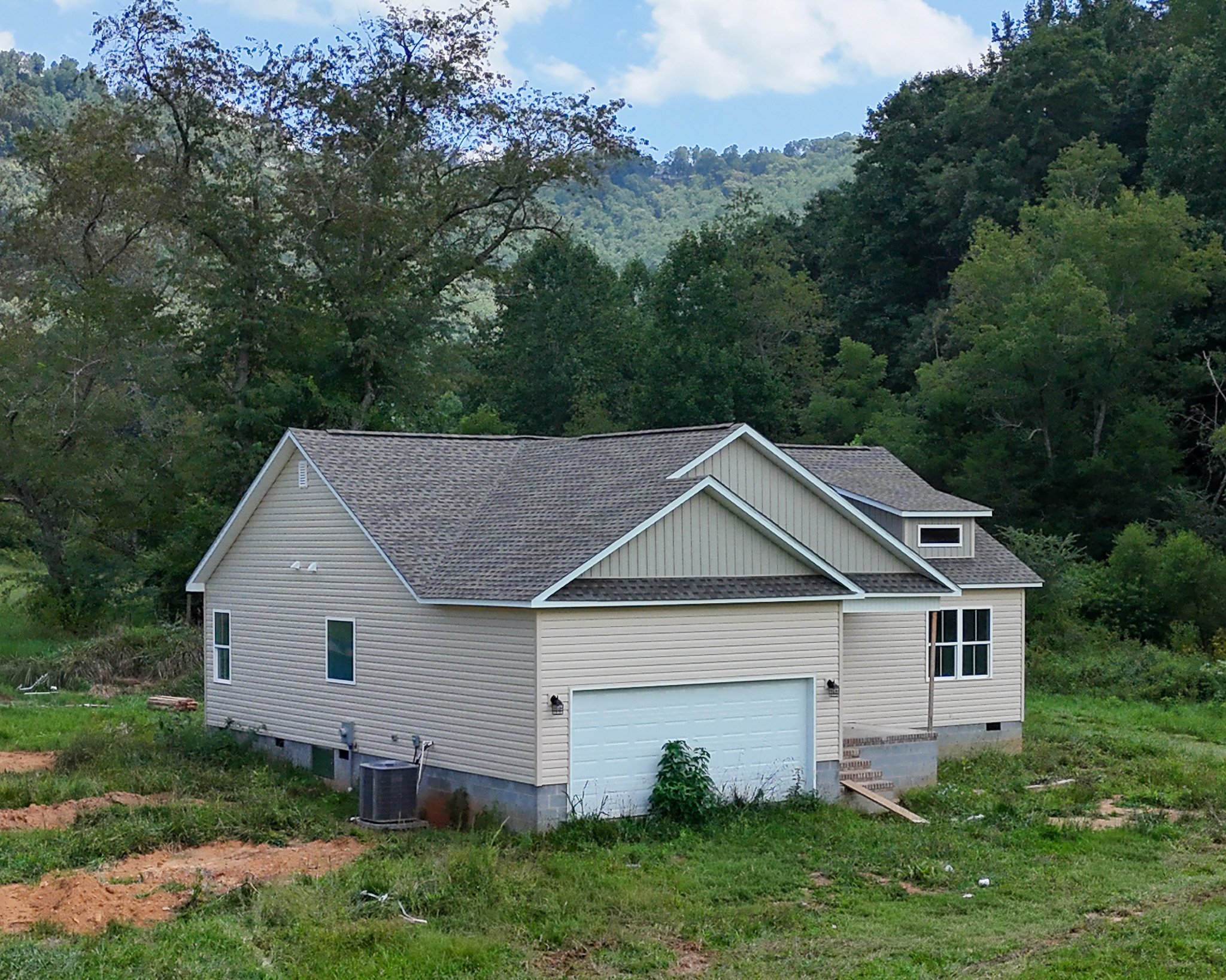 Side view of the home showing the two-car garage