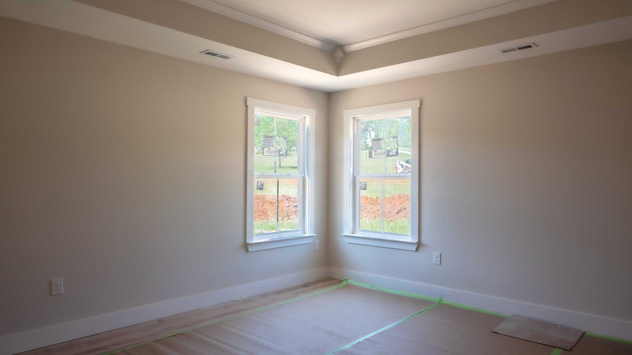 Same Charlotte plan at 40 Meadow Ridge Road: primary bedroom with a tray ceiling and crown molding