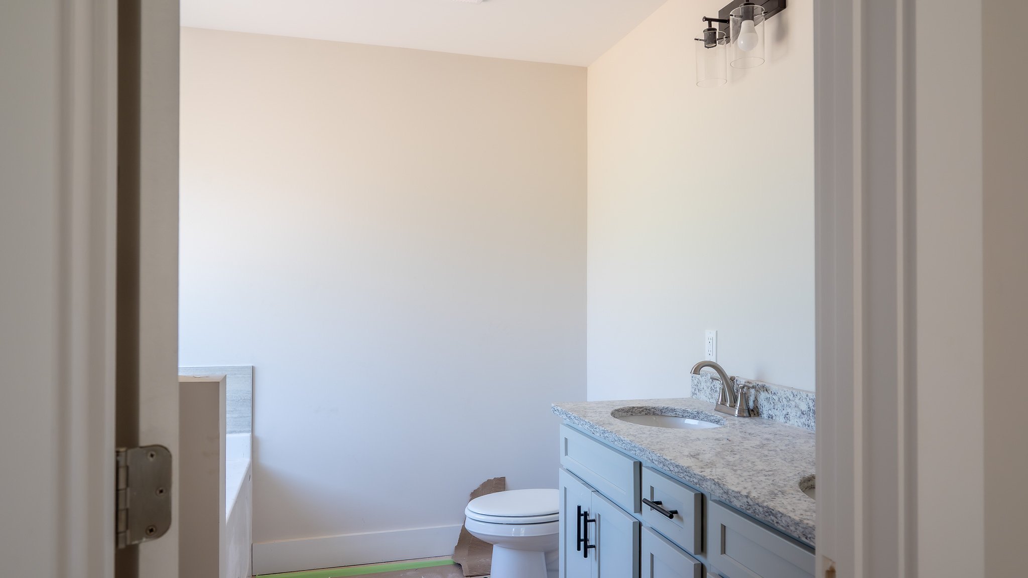 Same Charlotte plan at 40 Meadow Ridge Road: primary bath with granite vanity