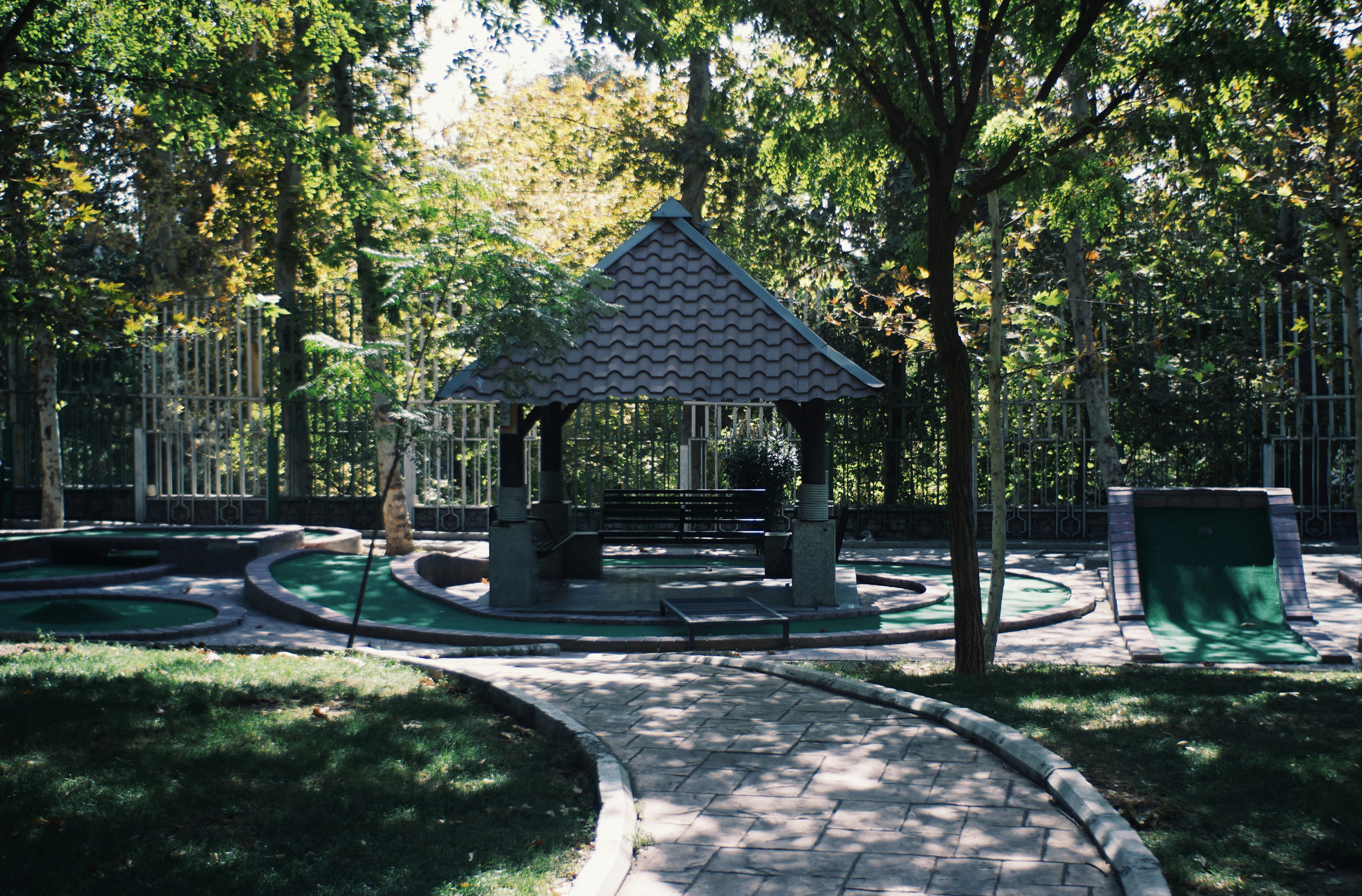 A miniature golf course lined with turning autumn trees on a fall afternoon near Asheville, North Carolina.