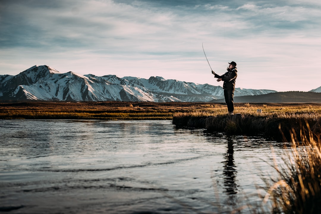 fly fishing cast water reflection mountain