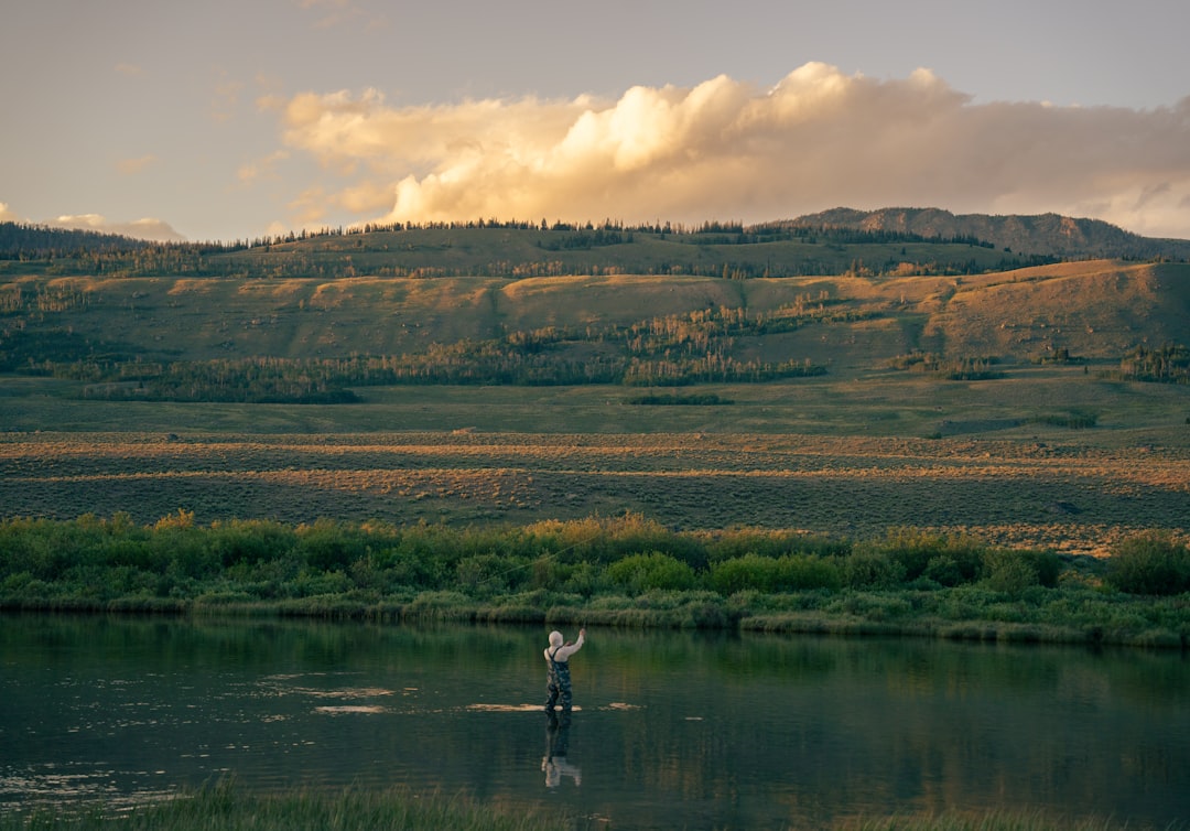 mountain river fly fisherman sunrise