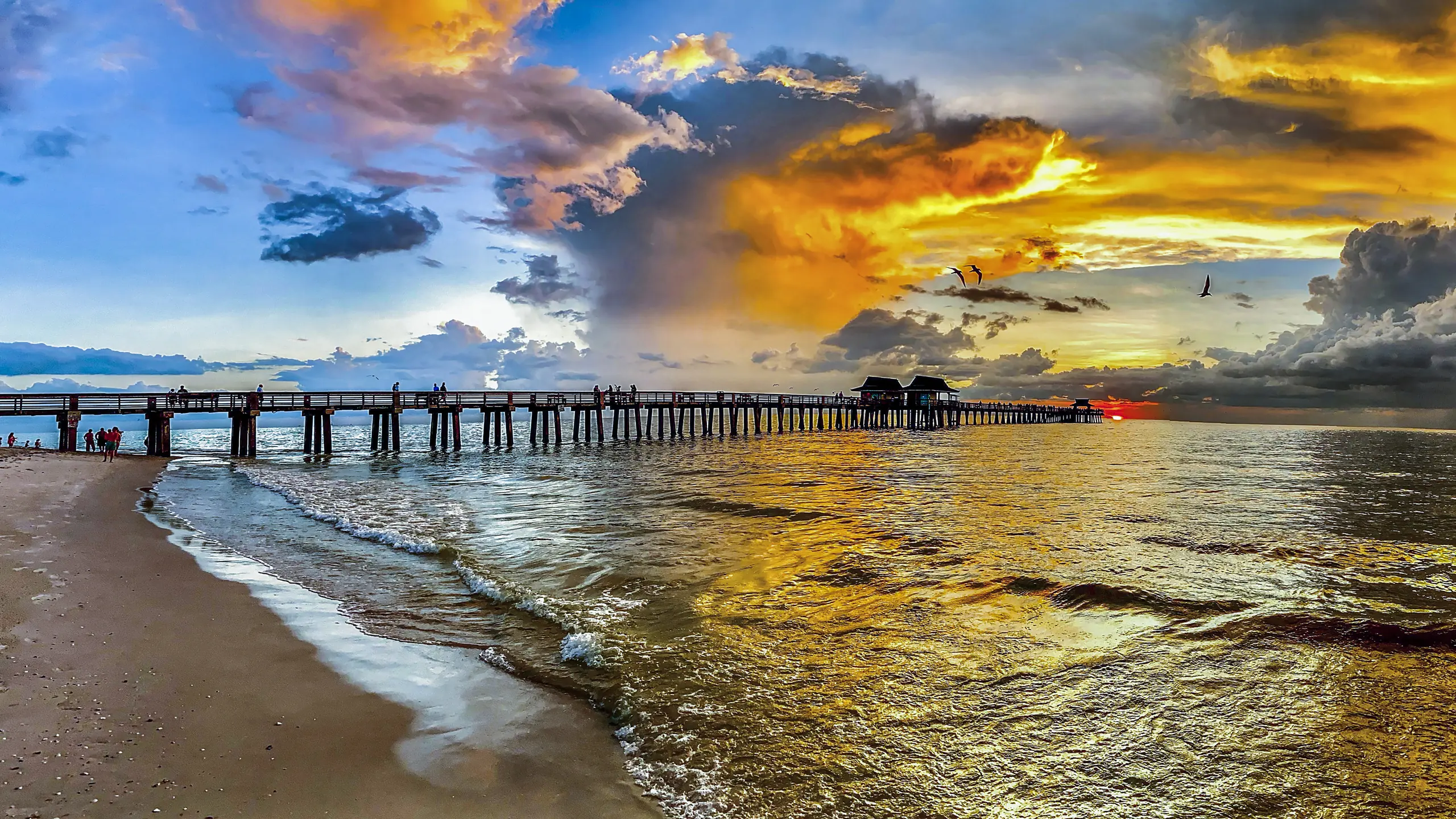 The Naples Pier at sunset over the Gulf of Mexico