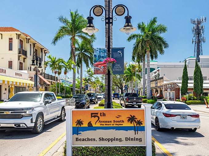 The Fifth Avenue South sign in downtown Naples, lined with palms and shops