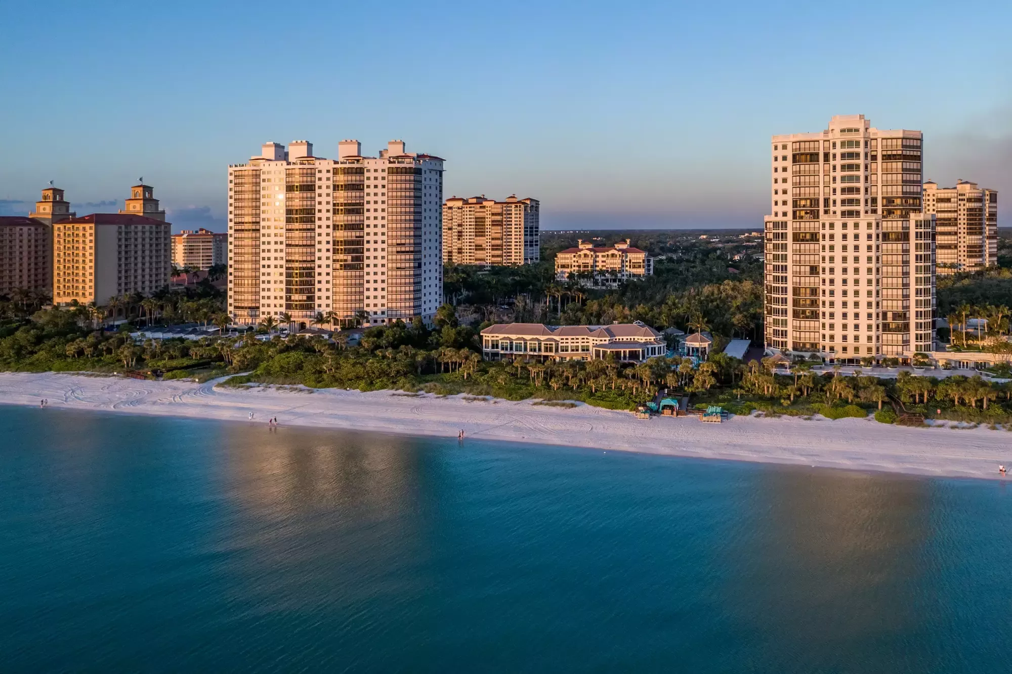 Pelican Bay beachfront towers and beach at golden hour, Naples, Florida