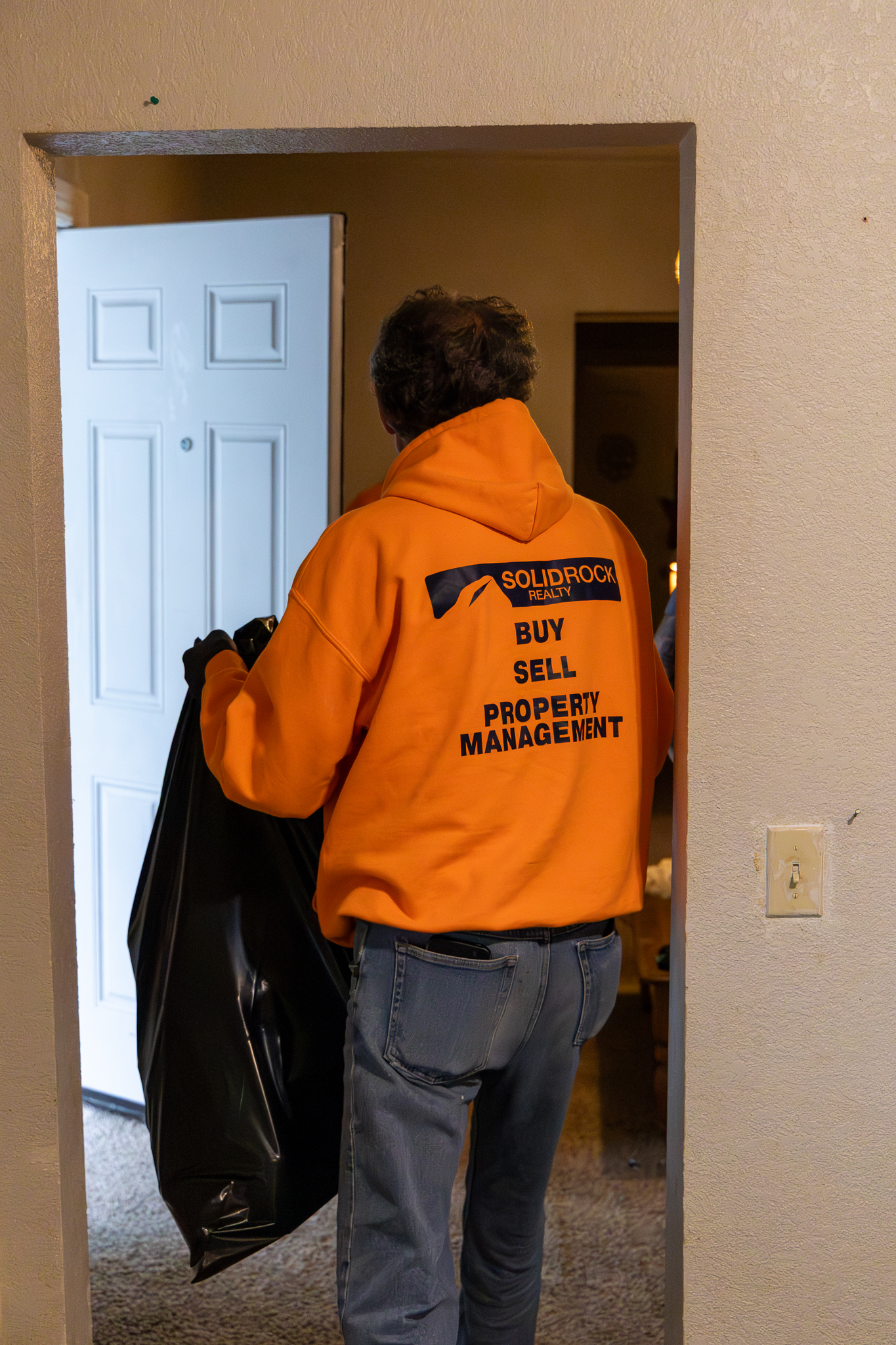 Eviction team removing trash bags