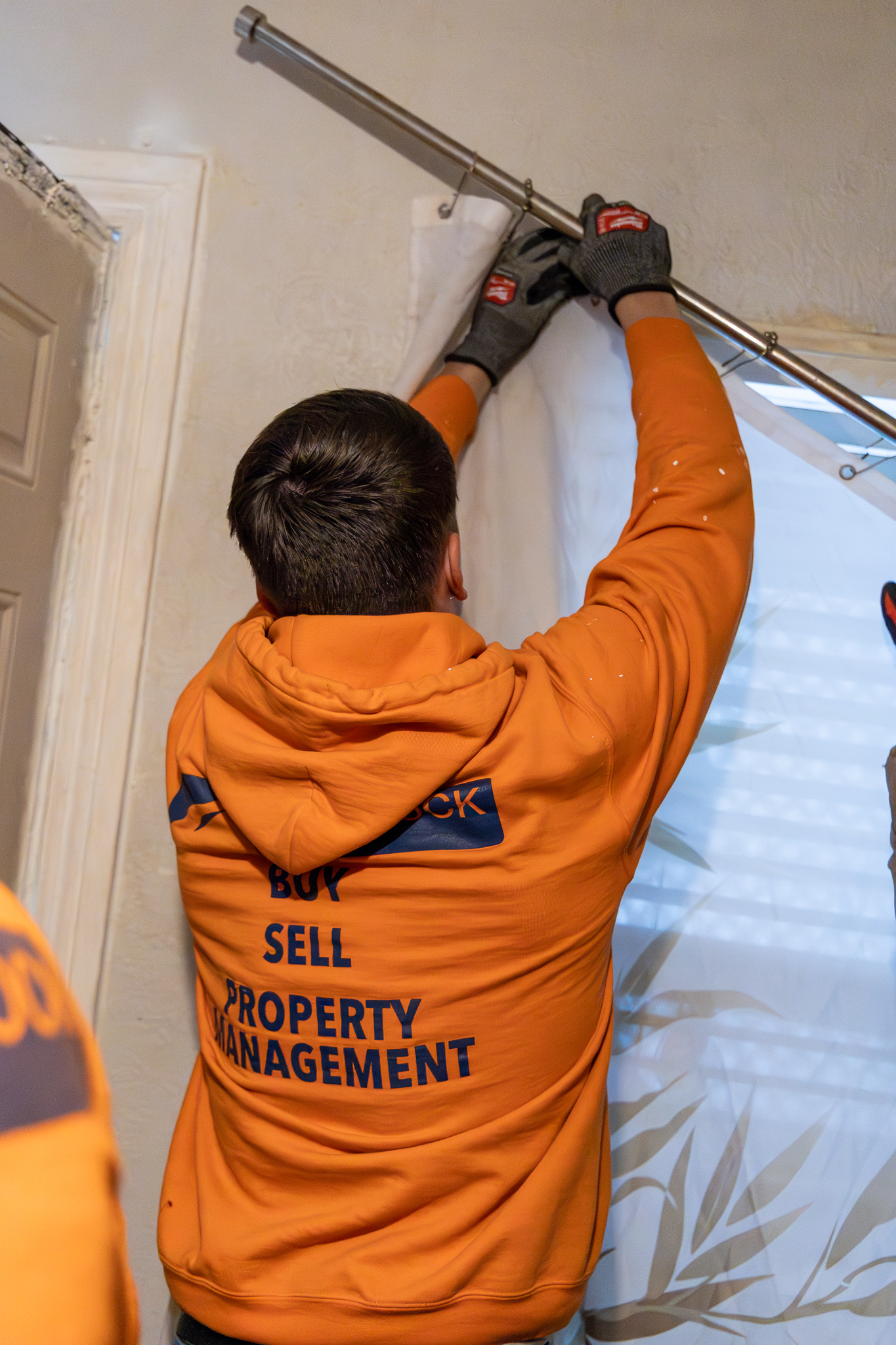 Eviction team removing shower curtain