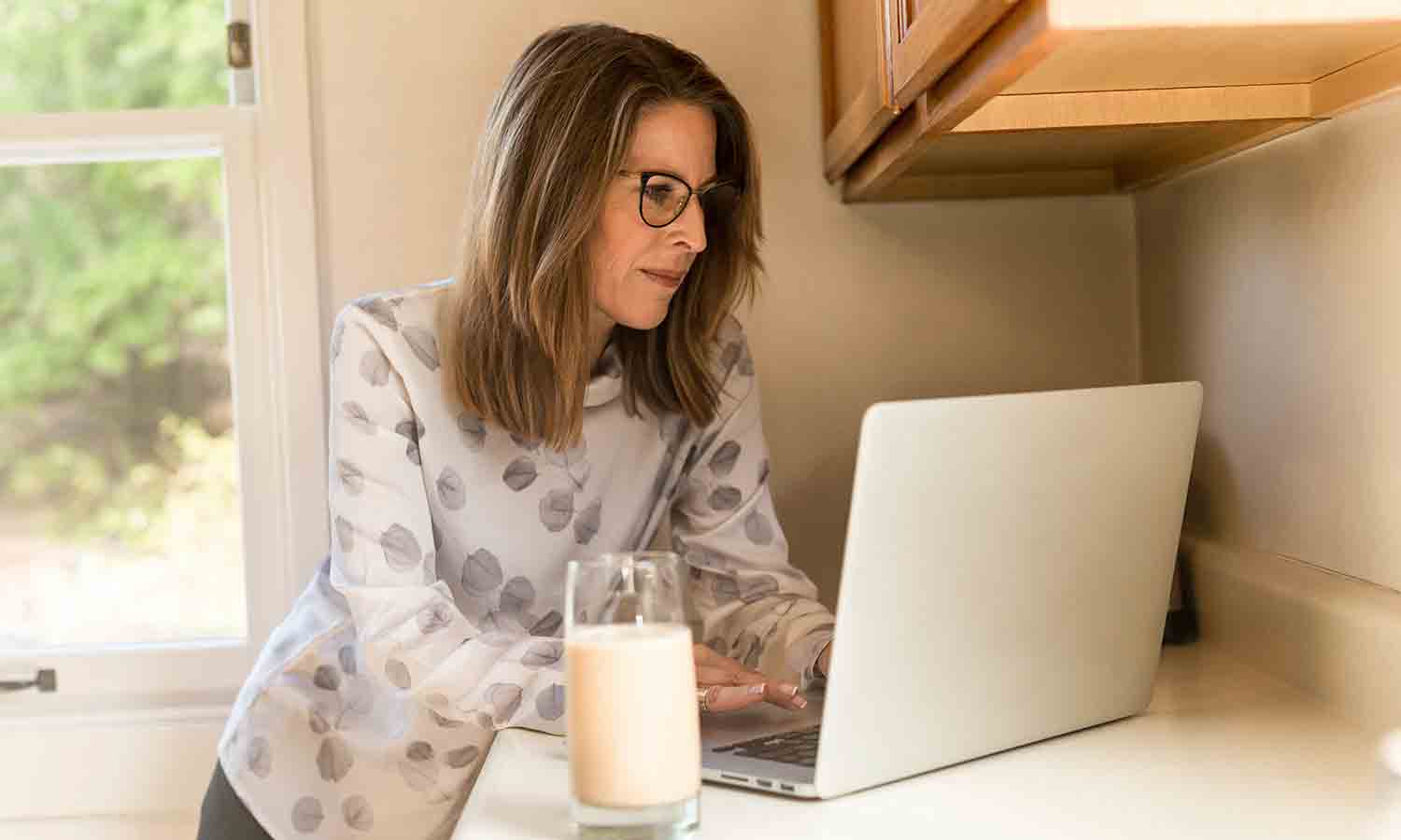 woman using the internet inside her house