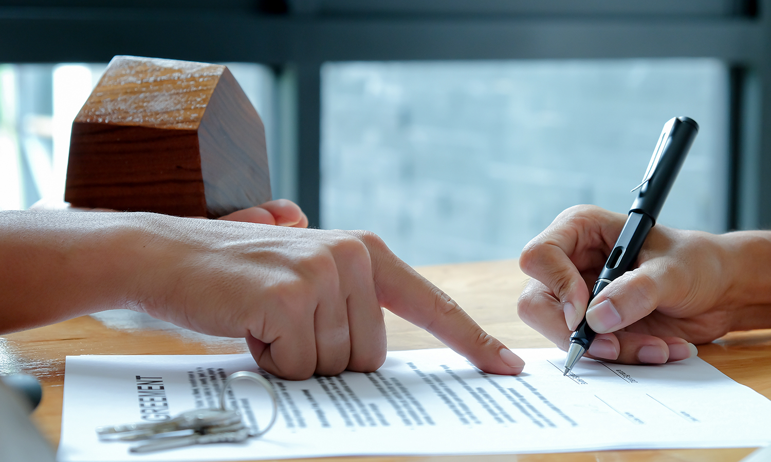 first-time home buyer signing purchase agreement