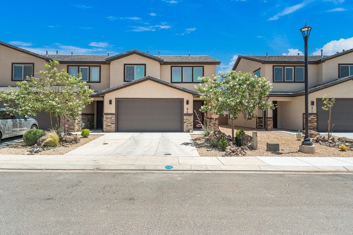 Two-story townhomes with two-car garages and desert landscaping in Southern Utah