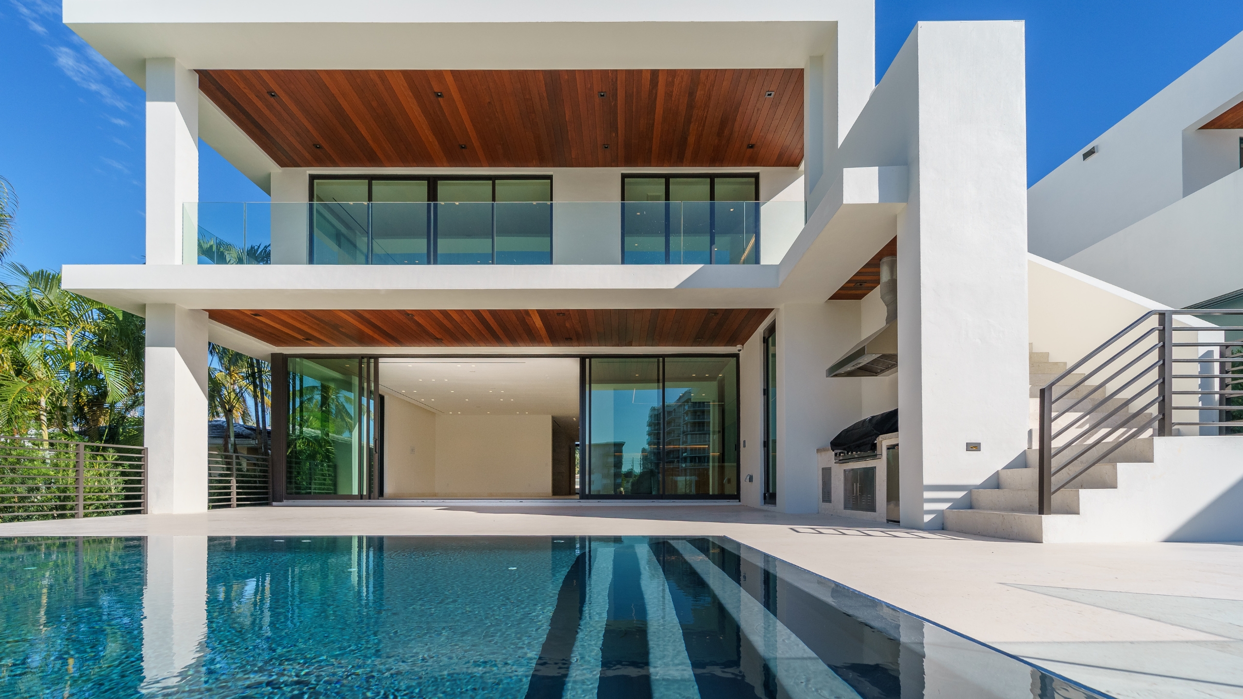 New construction modern waterfront home with pool