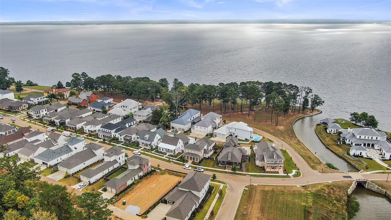 Aerial view of Lost Rabbit waterfront homes with traditional architecture along Ross Barnett Reservoir shoreline