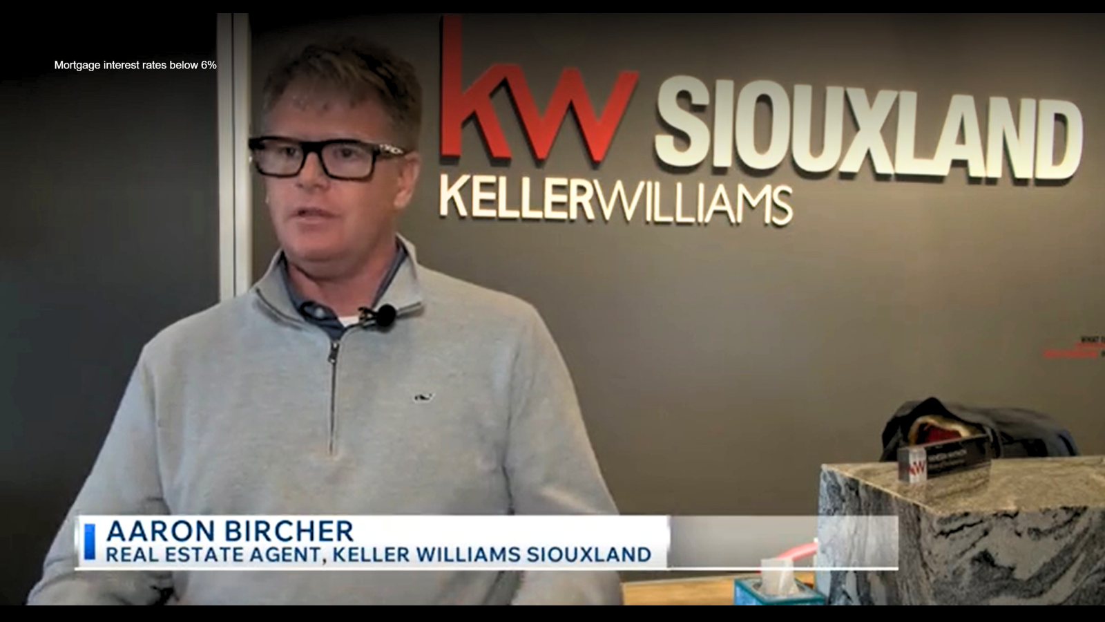 Aaron Bircher discussing mortgage interest rates below 6% during KCAU News interview about the Northwest Iowa housing market