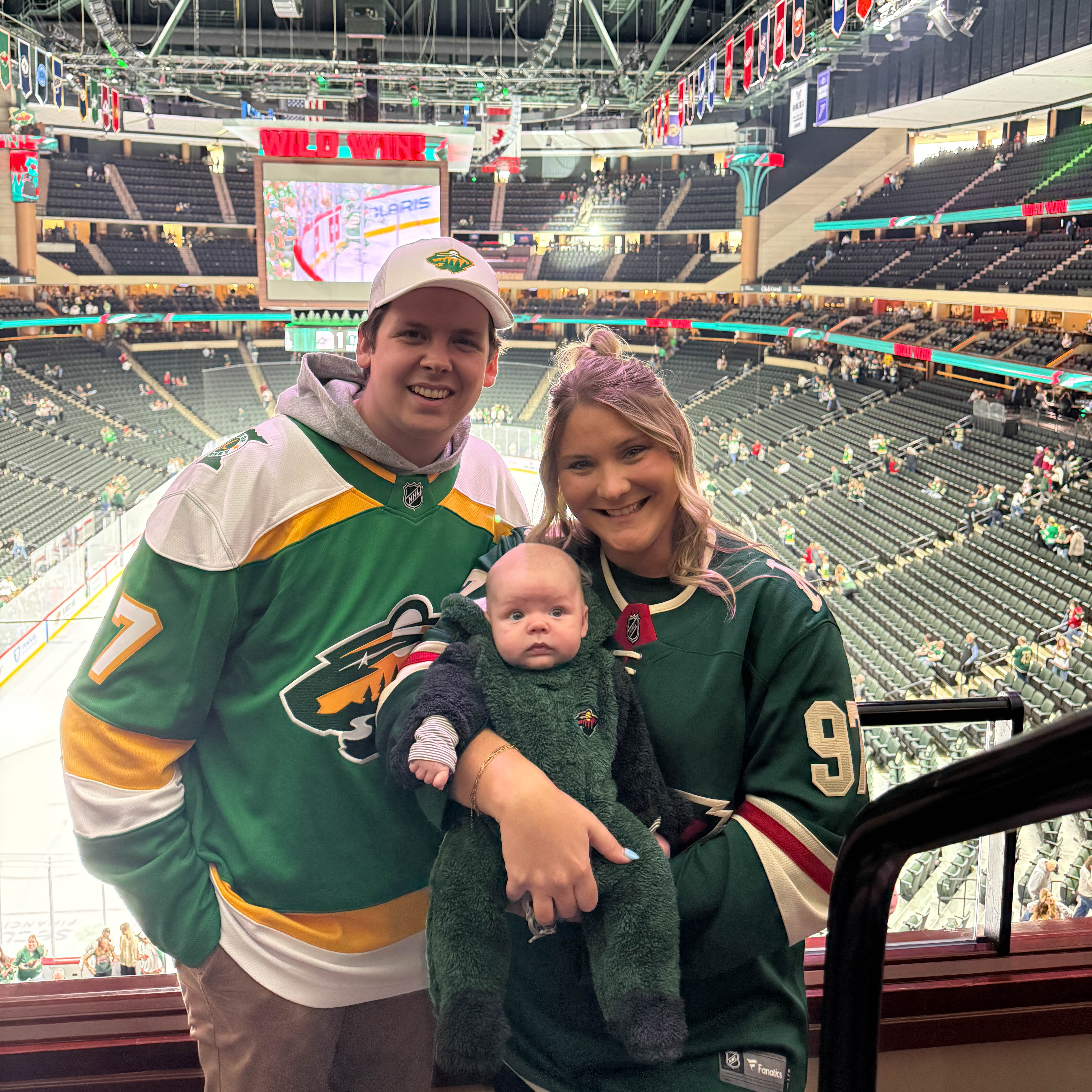 Tyler, Kayla and Easton at a Minnesota Wild game