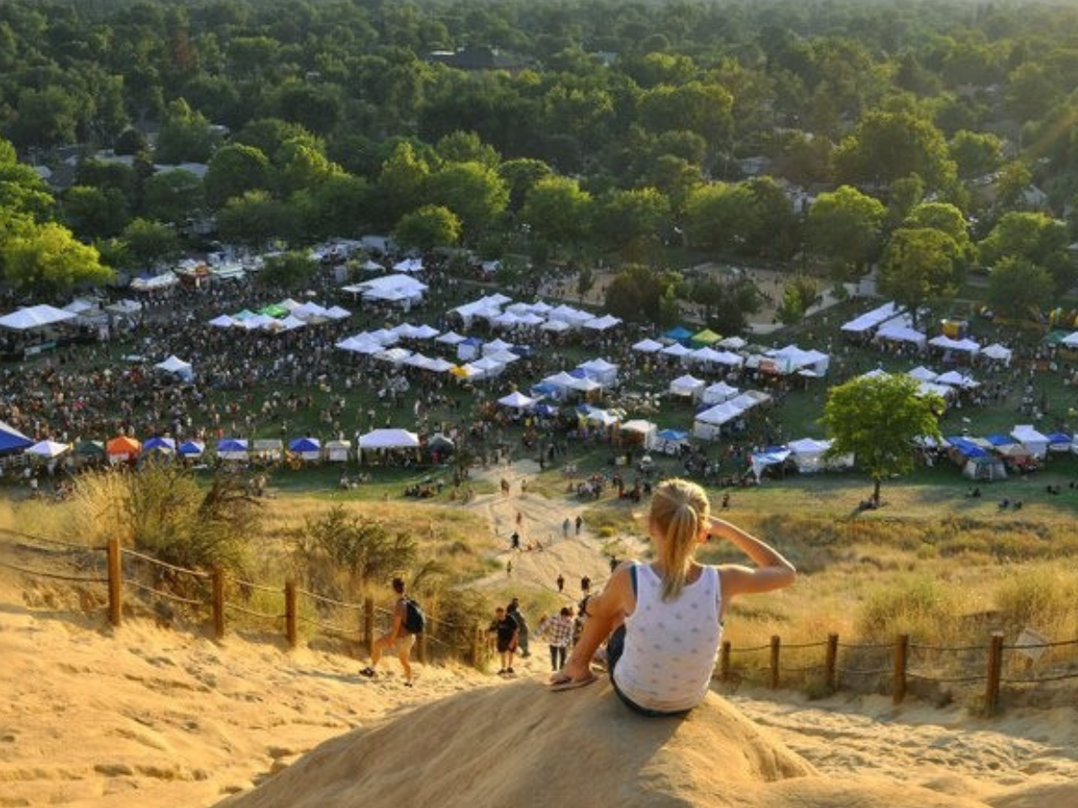 Visitors enjoy the hillside at Camel's Back Park above Hyde Park in Boise's North End, a popular gathering place with access to the Boise Foothills trail system.