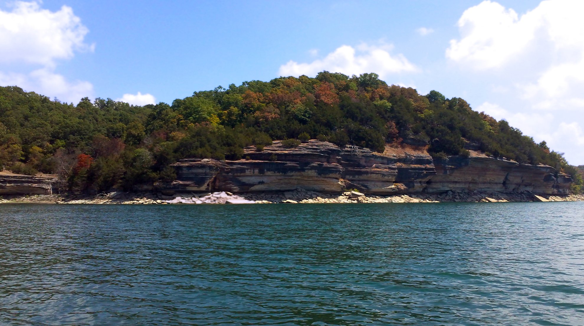 Beaver Lake shoreline and forested bluffs near Rogers Arkansas