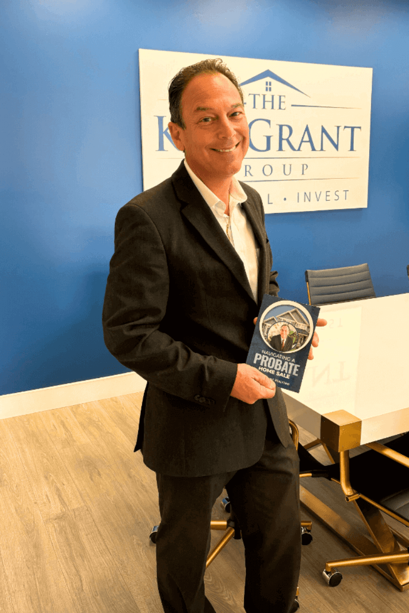 ron pacioni a probate real estate specialists holding his published guide on  navigating probate sales