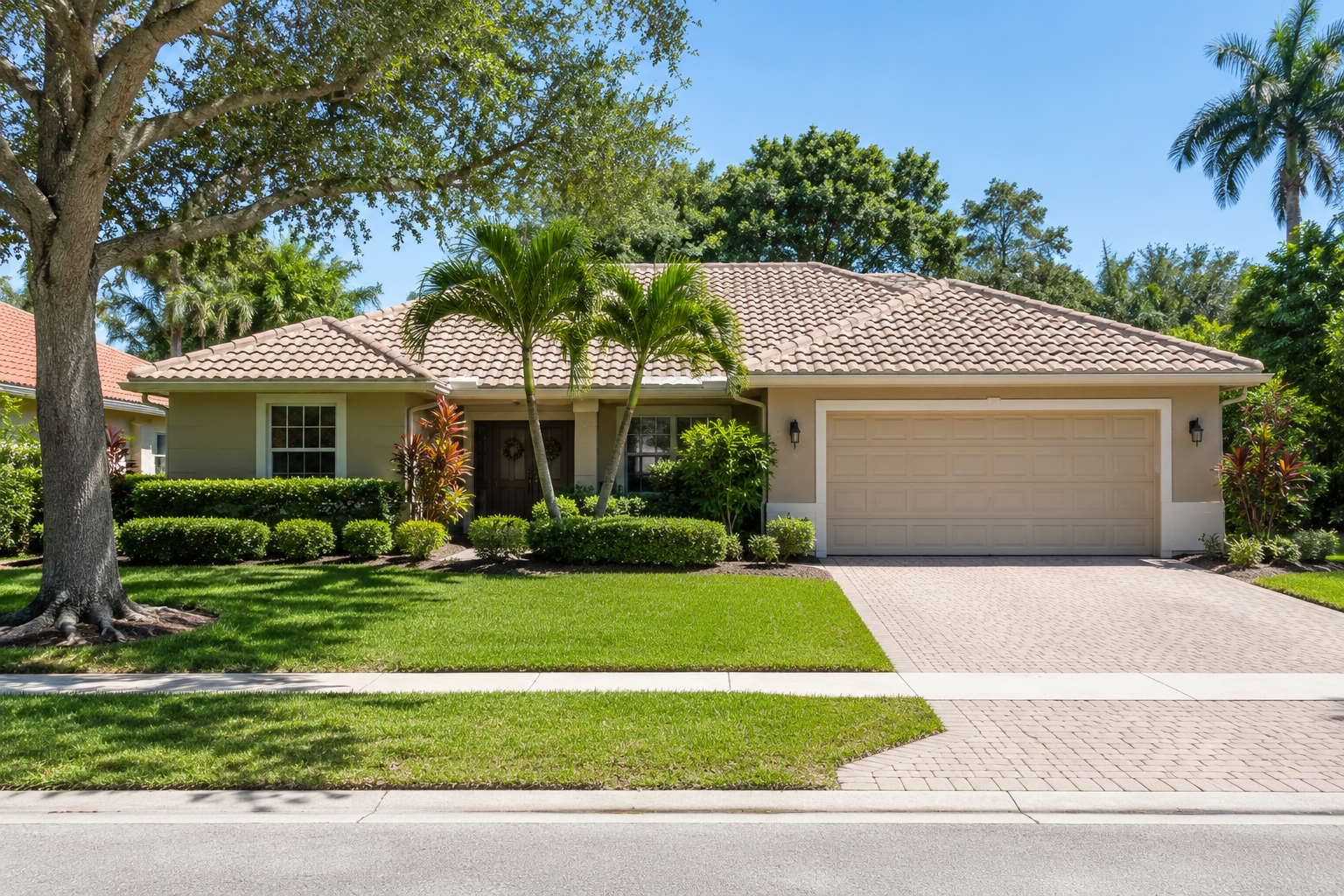 A single-family residence in Palm Beach County, Florida, photographed straight on with the full structure and parcel in frame. The scene accompanies an article on home value versus replacement cost — how market value, replacement cost, lending value and assessed value measure different things about the same property. The framing is deliberately plain: one house, several measures.