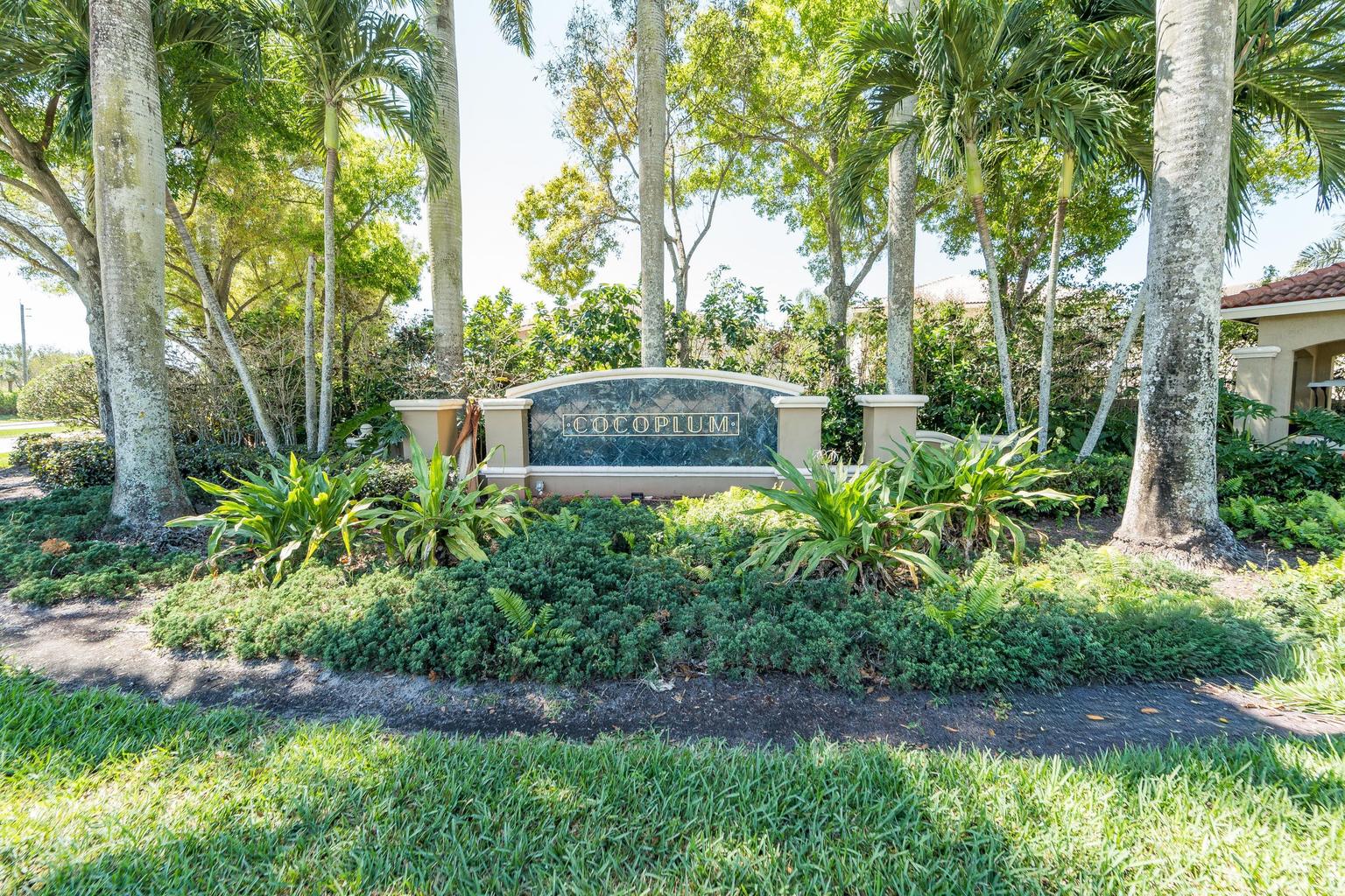 Gated Cocoplum community entrance with landscaped surroundings Lake Worth Florida