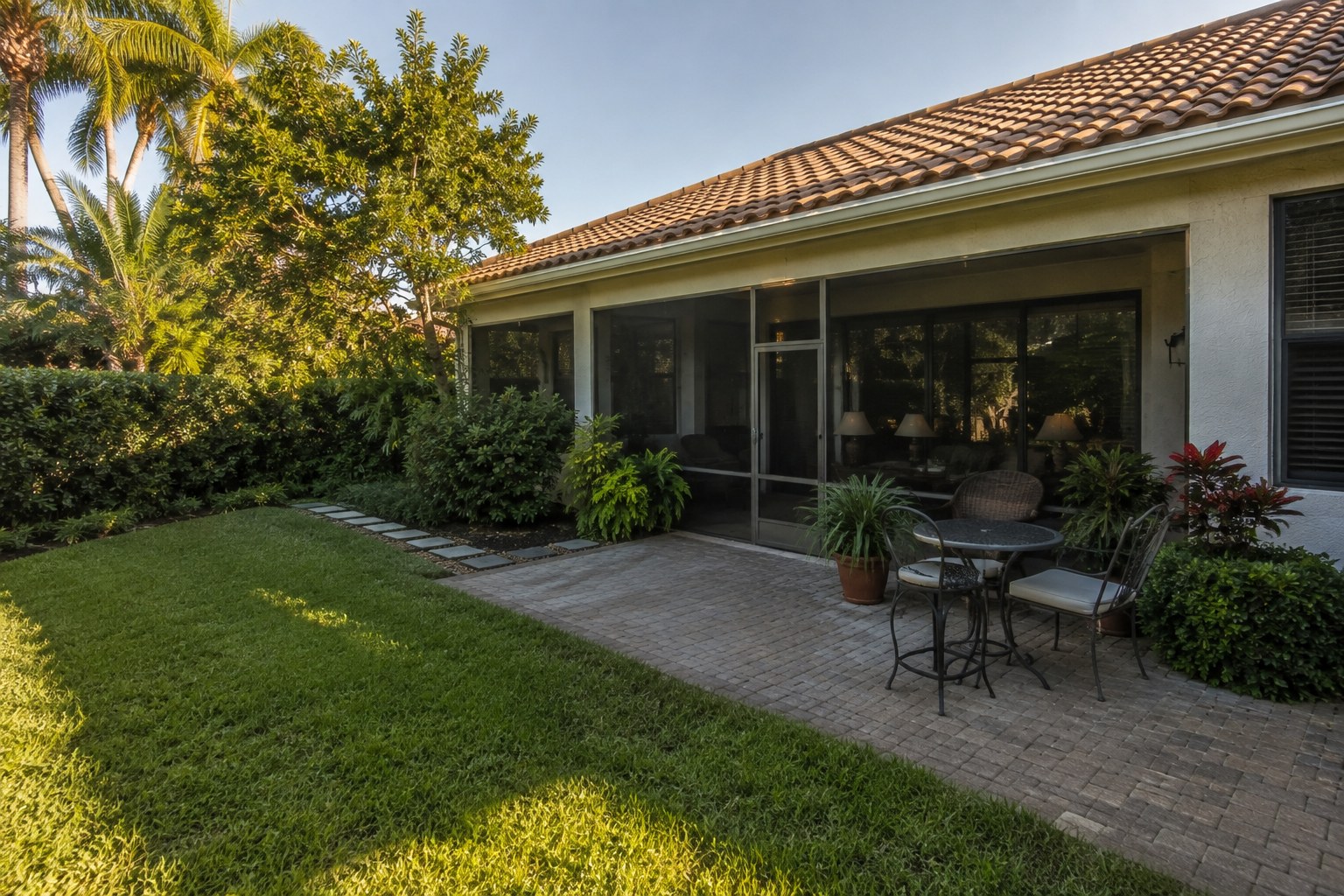 Rear elevation of an established Palm Beach County home supporting a blog on adaptation feasibility, permitting tiers and which authorities decide what may be changed.