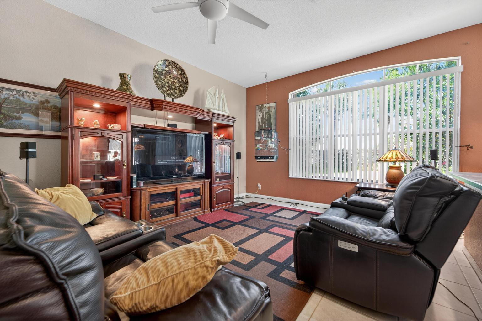 Living and dining area with high ceilings in Lake Worth Florida home