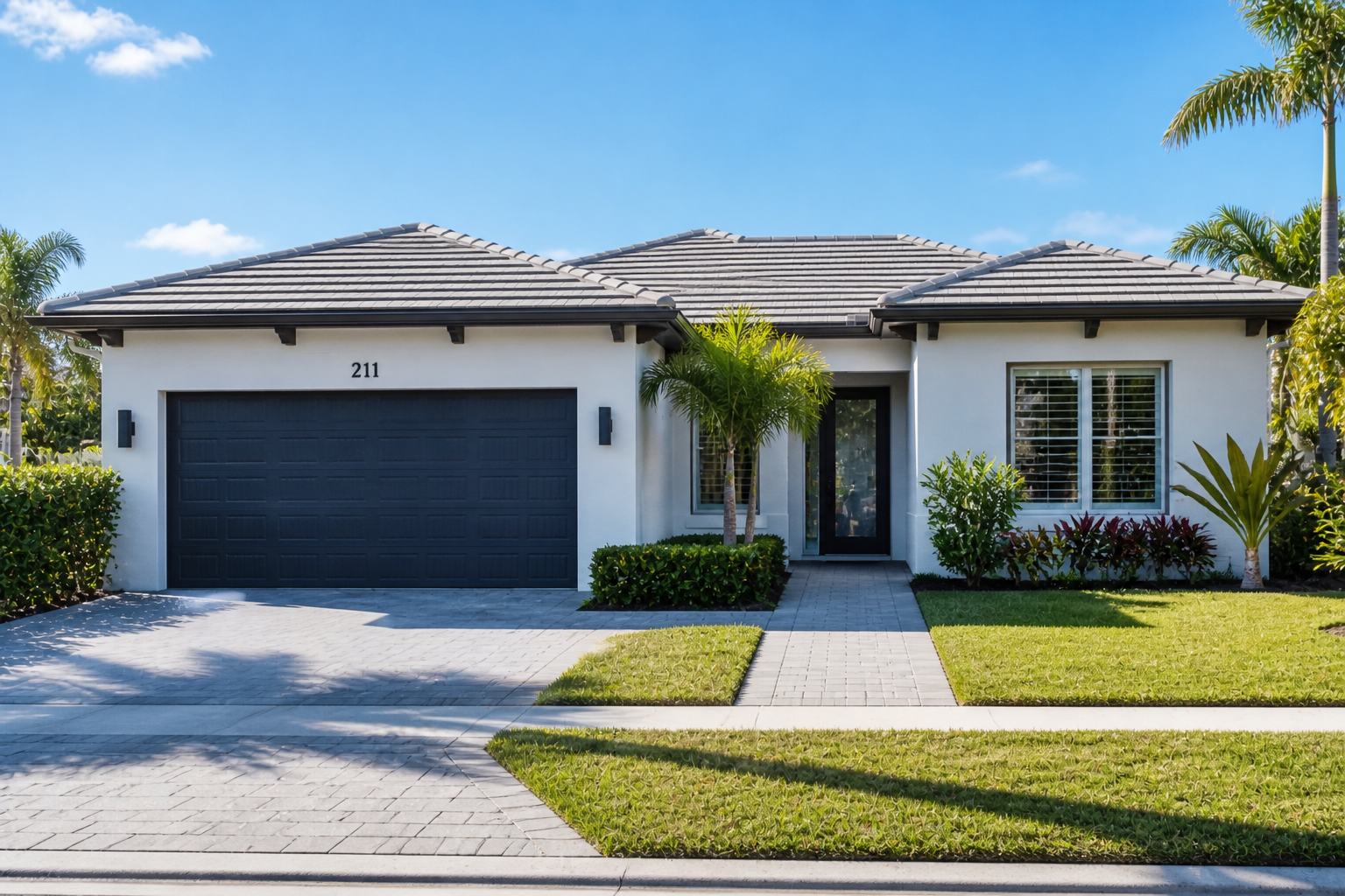 South Florida low-maintenance home with clean landscaping and simple exterior design reflecting easier living in Palm Beach County