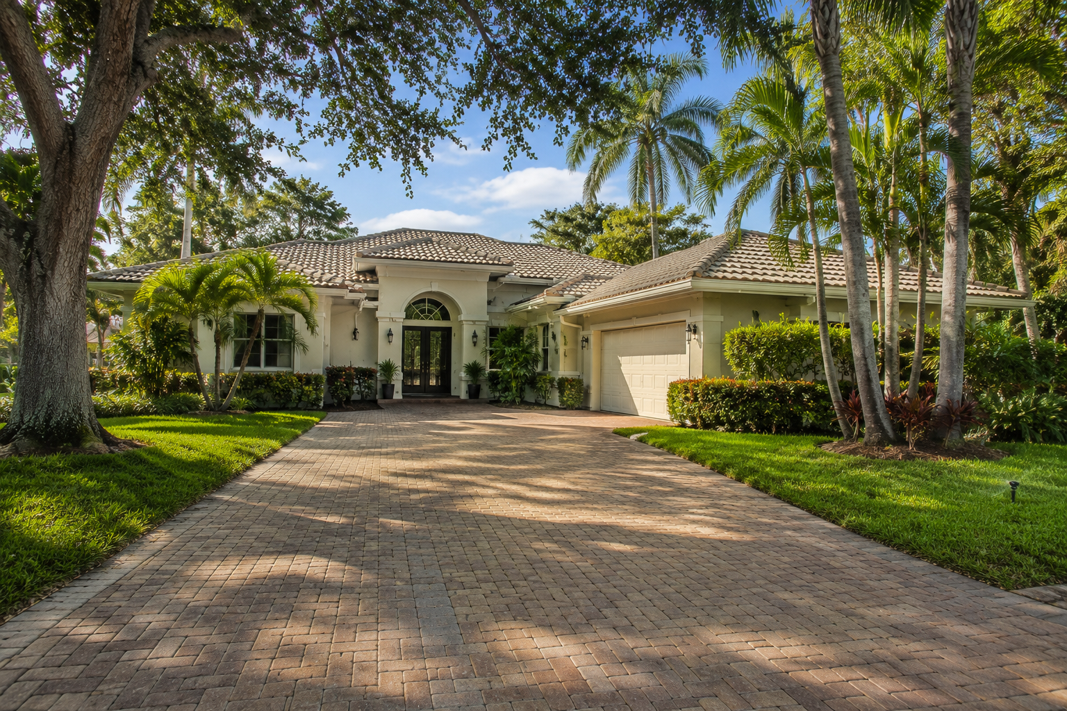 Residential exterior representing the ongoing carrying costs attached to a Palm Beach County home — roof, exterior surfaces, landscaping and irrigation. Supports a consumer-education blog asset on the full cost of moving up beyond the purchase price.
