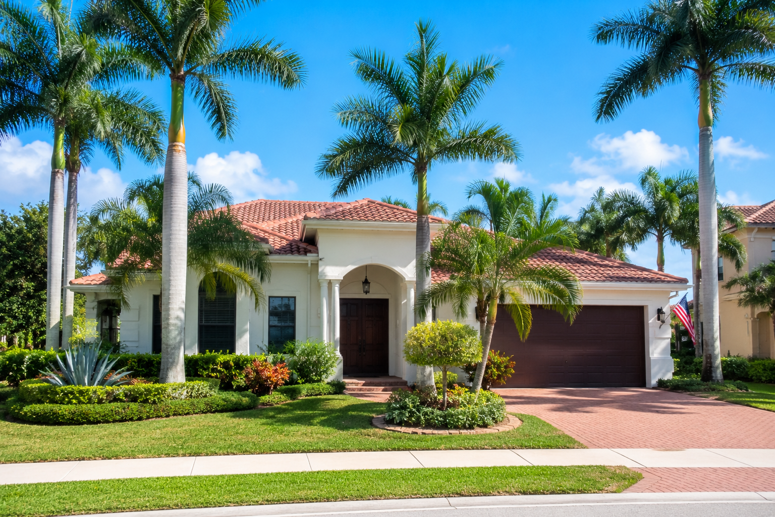 Sunny residential neighborhood in West Palm Beach Florida with palm trees, landscaped homes, and bright South Florida natural light.
