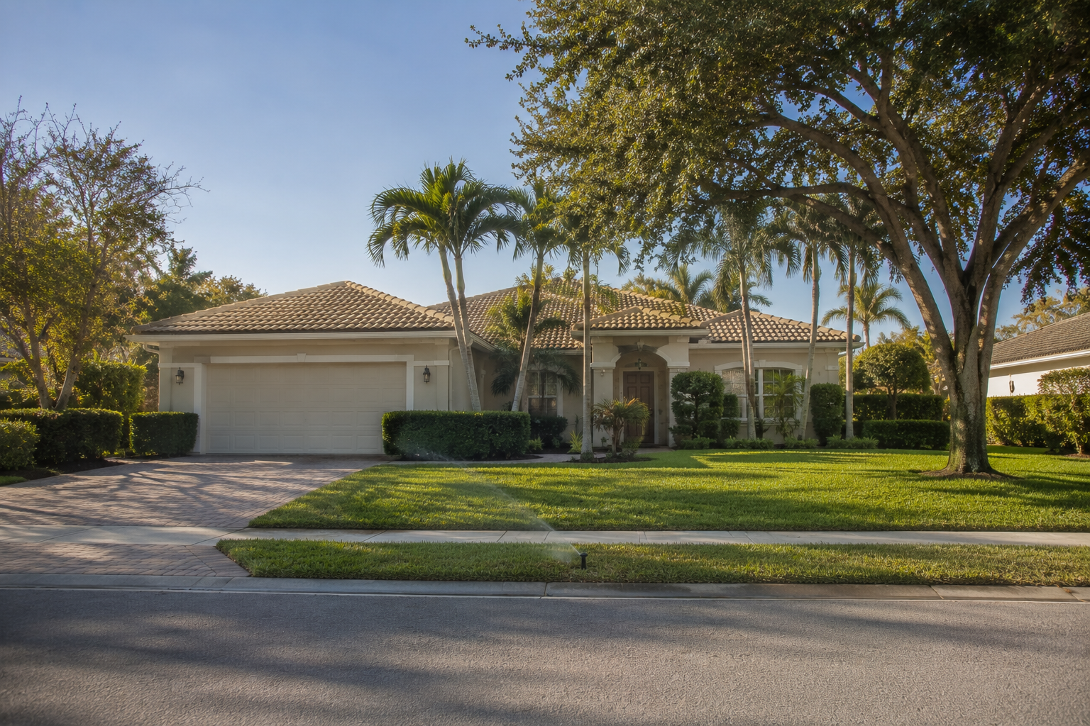 Detached single-family residential exterior representing the ownership boundary that shifts when a Palm Beach County household moves from attached housing. Supports a consumer-education blog asset on what changes in maintenance, insurance structure and reserves.