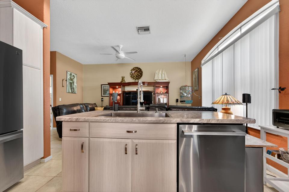 Updated kitchen with modern appliances in Cocoplum home Lake Worth Florida